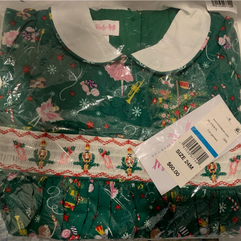 NWT Baby Nutcracker themed smocked holiday dress.